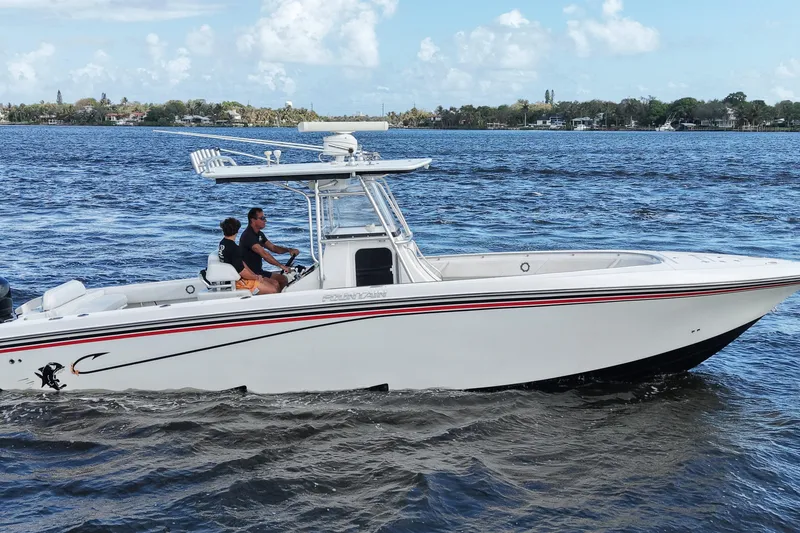 Slide: The Image of 2005 Fountain 34 Tournament Edition boat cruising on a sunny day. - 7