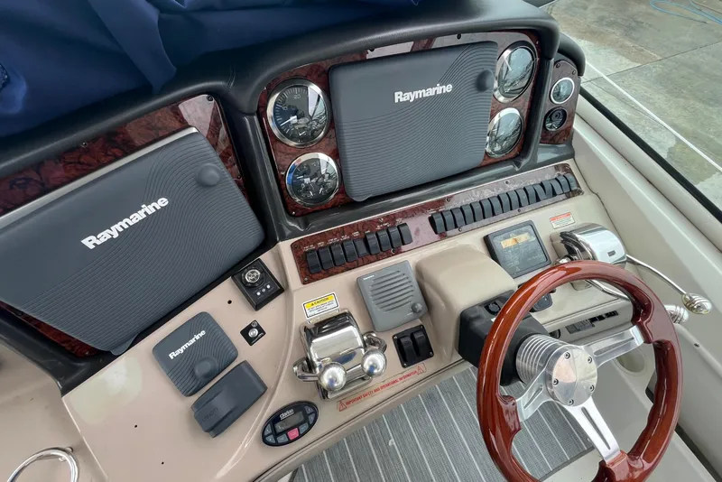Slide: The Image of Luxurious cabin interior of a 2004 Sea Ray 420 Sundancer yacht with cozy bedding. - 19