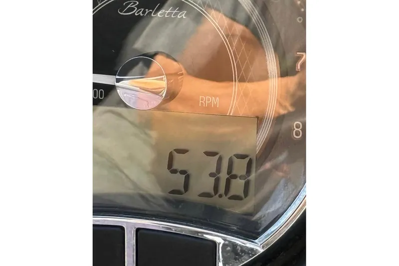 Slide: The Image of Close-up of 2023 Barletta C22CC RPM gauge displaying 5.3. - 9
