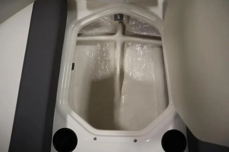 Slide: The Image of 2025 Bayliner Element E18 boat storage compartment, open and empty. - 19