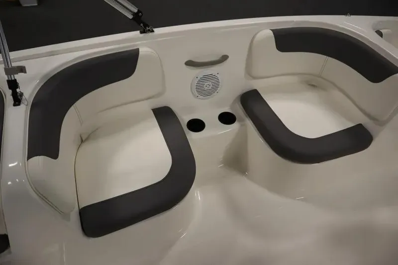Slide: The Image of 2025 Bayliner Element E18 boat seating area with cushioned seats and cup holders. - 23
