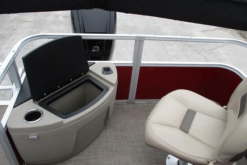 Slide: The Image of 2022 Sun Tracker Bass Buggy 18 DLX interior with storage compartment and seating. - 12
