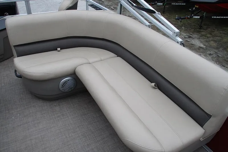 Slide: The Image of 2022 Sun Tracker Bass Buggy 18 DLX pontoon boat seating, beige upholstery, outdoor setting. - 14