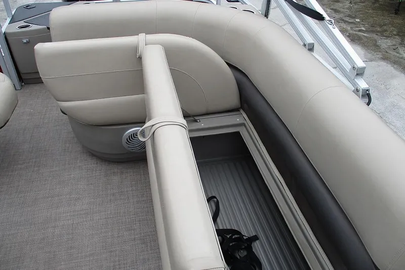 Slide: The Image of 2022 Sun Tracker Bass Buggy 18 DLX interior seating with storage compartment. - 15