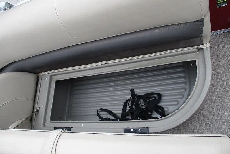 Slide: The Image of 2022 Sun Tracker Bass Buggy 18 DLX storage compartment with straps inside. - 16