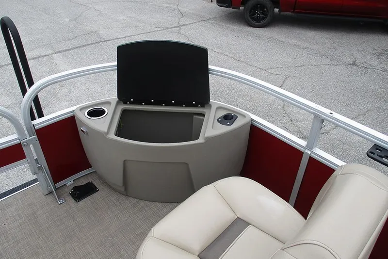 Slide: The Image of 2022 Sun Tracker Bass Buggy 18 DLX boat interior with seating and storage compartment. - 19