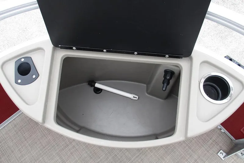 Slide: The Image of 2022 Sun Tracker Bass Buggy 18 DLX storage compartment with cup holders and drainage. - 22