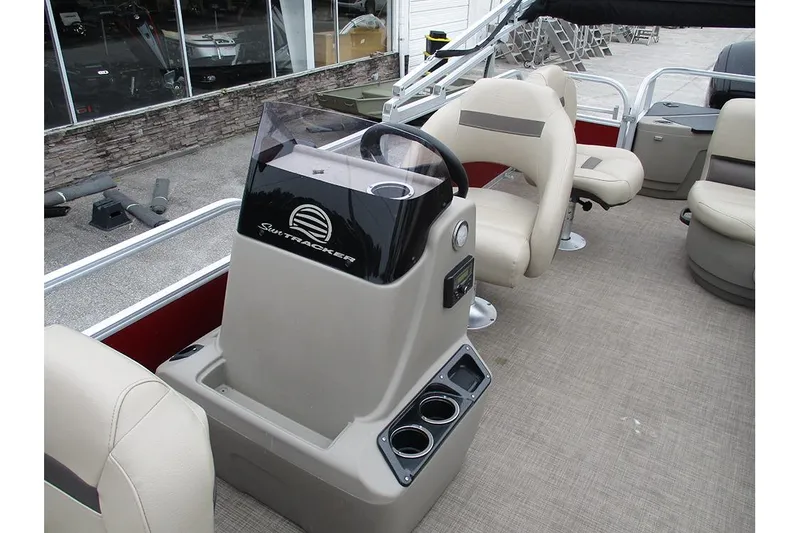 Slide: The Image of 2022 Sun Tracker Bass Buggy 18 DLX interior with helm and seating area. - 23