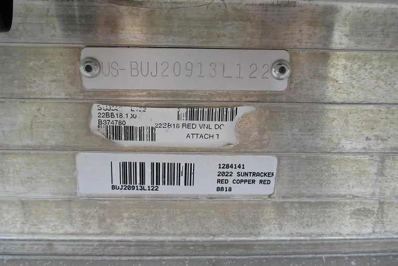 Slide: The Image of 2022 Sun Tracker Bass Buggy 18 DLX identification plate with serial numbers and barcodes. - 25