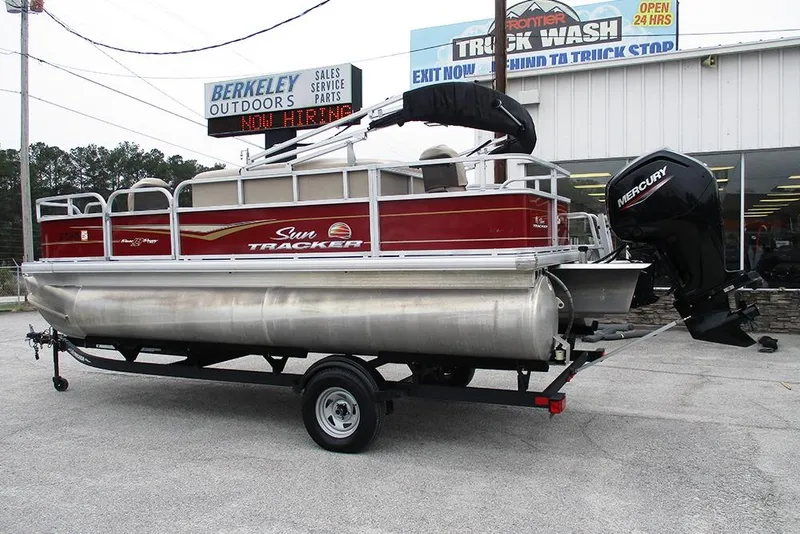 Slide: The Image of 2022 Sun Tracker Bass Buggy 18 DLX pontoon boat on trailer at dealership. - 7