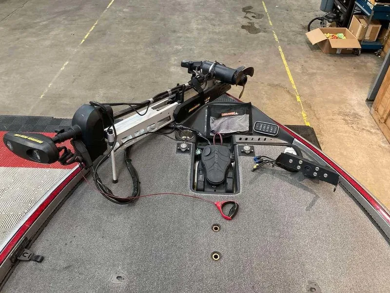 Slide: The Image of 2017 Triton 21 TrX boat deck with trolling motor and control panel. - 10