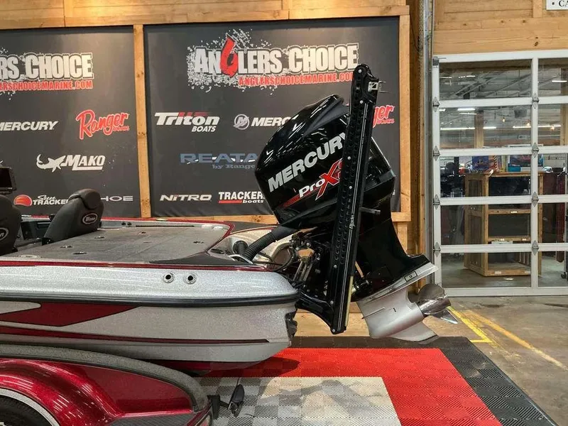 Slide: The Image of 2017 Triton 21 TrX boat with Mercury Pro XS engine in showroom. - 3