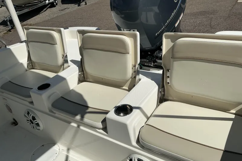 Slide: The Image of 2015 NauticStar 231 Hybrid boat seats with cup holders and Yamaha engine. - 7