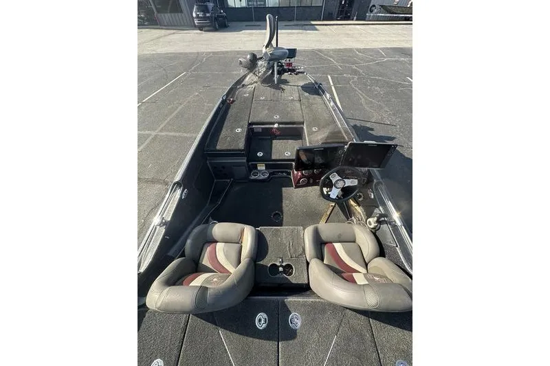 Slide: The Image of 2014 Bass Cat Puma FTD boat interior with dual seats and steering console. - 7