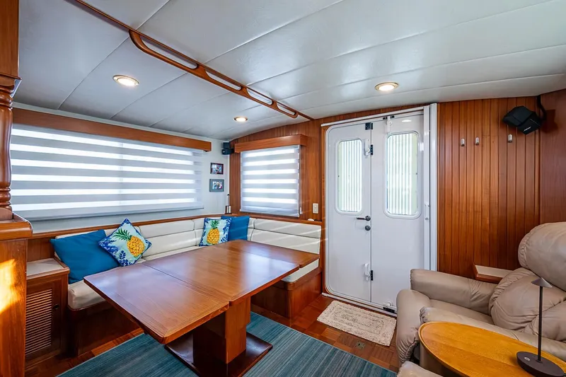 Slide: The Image of Luxurious interior of 2008 Kadey-Krogen 44 yacht with wood paneling and cozy seating area. - 11