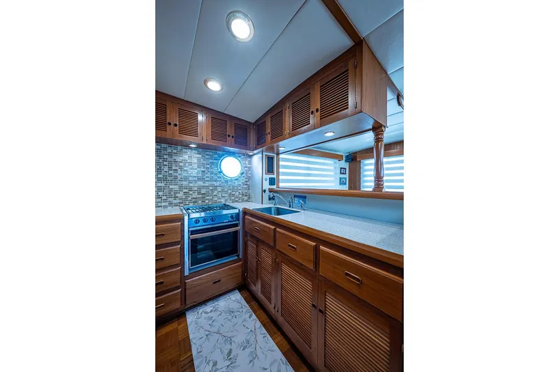 Slide: The Image of Luxurious 2008 Kadey-Krogen 44 yacht kitchen with wood cabinetry and modern appliances. - 15