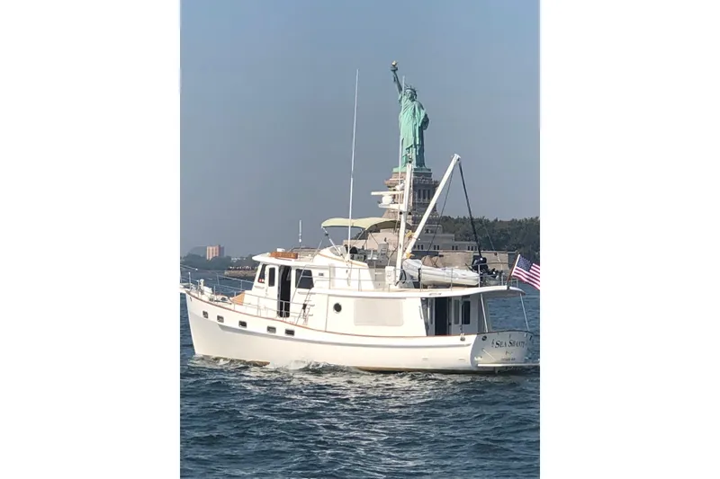 Slide: The Image of Kadey-Krogen 44 yacht cruising near the Statue of Liberty, 2008 model. - 2