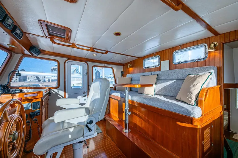 Slide: The Image of Luxurious 2008 Kadey-Krogen 44 yacht interior with plush seating and elegant wood finishes. - 20