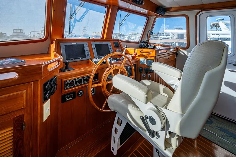 Slide: The Image of Pilot house of 2008 Kadey-Krogen 44 yacht with navigation equipment and captain's chair. - 21