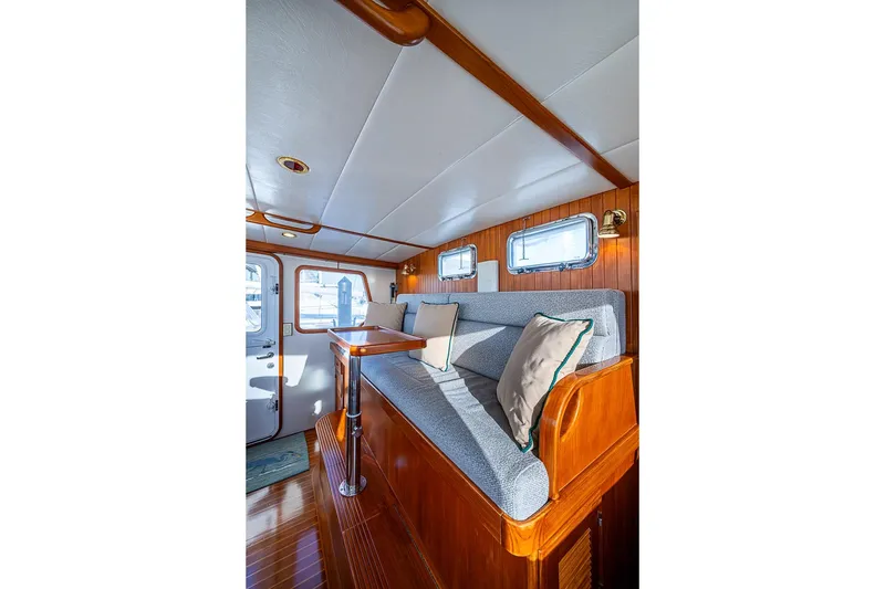 Slide: The Image of Interior of 2008 Kadey-Krogen 44 yacht with cozy seating and wooden accents. - 22