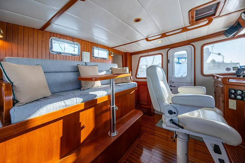 Slide: The Image of Pilothouse interior of 2008 Kadey-Krogen 44 yacht with seating and helm chair. - 25