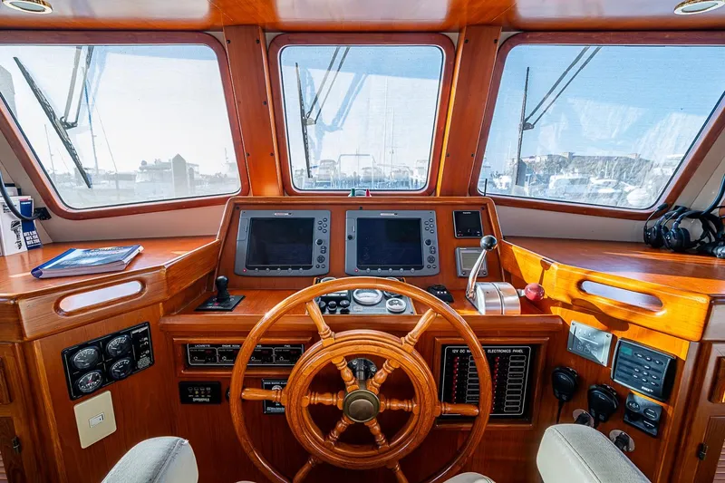Slide: The Image of Pilothouse of 2008 Kadey-Krogen 44 yacht with wooden helm and navigation equipment. - 26