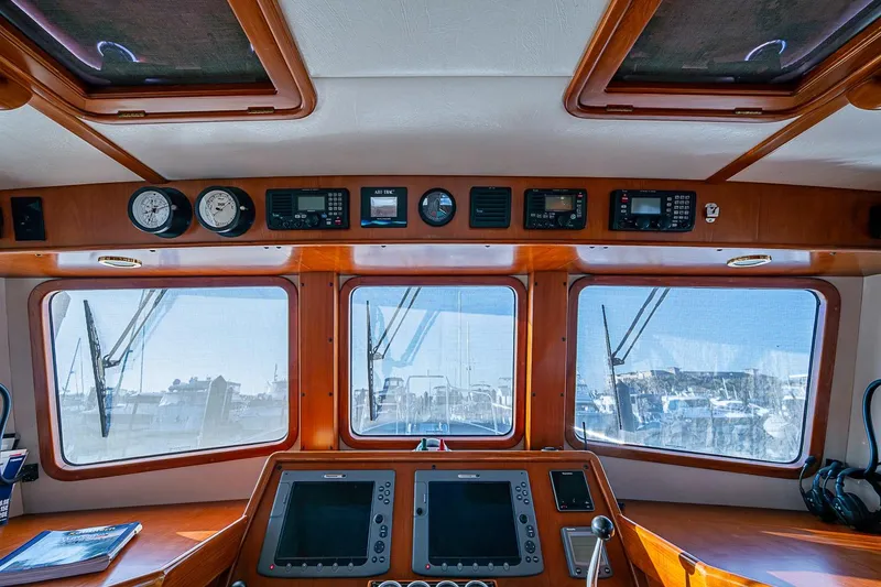Slide: The Image of Pilothouse interior of 2008 Kadey-Krogen 44 yacht with navigation equipment and large windows. - 27