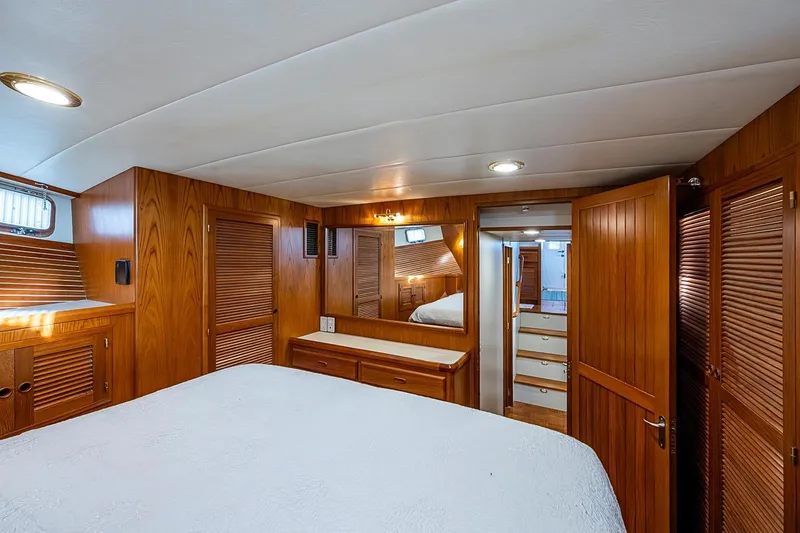 Slide: The Image of Luxurious 2008 Kadey-Krogen 44 yacht interior with elegant wood paneling and cozy bedroom. - 29