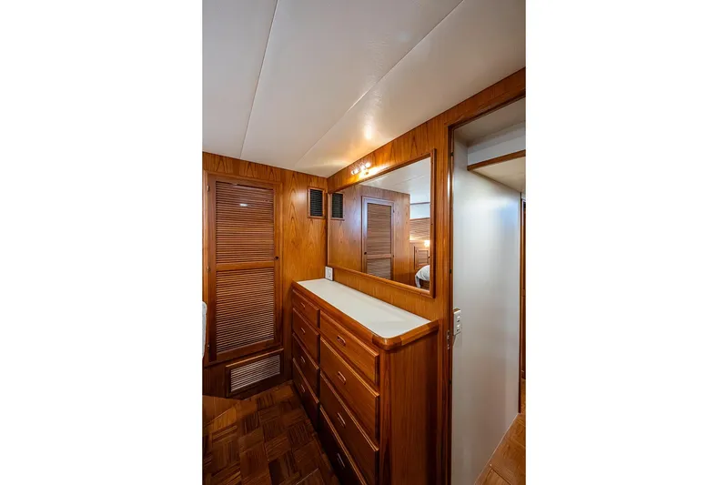 Slide: The Image of Interior of 2008 Kadey-Krogen 44 yacht featuring wooden cabinetry and mirror. - 31