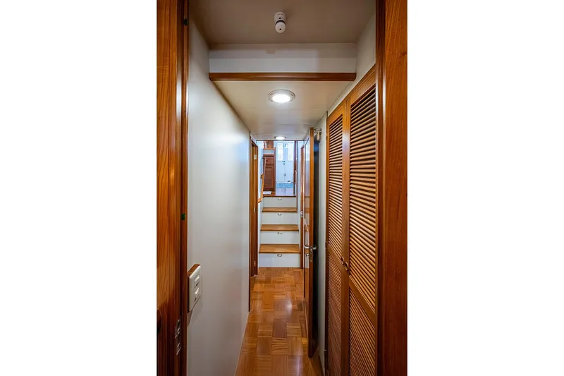 Slide: The Image of Hallway of 2008 Kadey-Krogen 44 yacht with wooden finishes and stairs. - 32