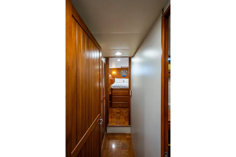 Slide: The Image of Interior hallway of 2008 Kadey-Krogen 44 yacht with wooden paneling and cozy bedroom. - 33