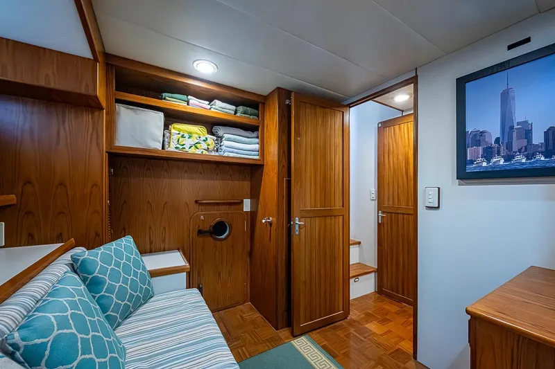 Slide: The Image of Cozy interior of 2008 Kadey-Krogen 44 yacht with wooden cabinetry and seating area. - 35