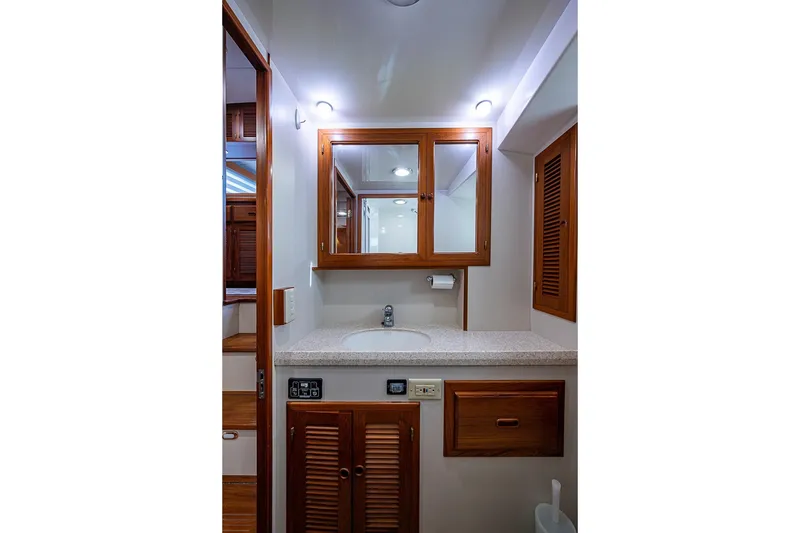 Slide: The Image of Kadey-Krogen 44 yacht bathroom, 2008 model, featuring wooden cabinetry and modern fixtures. - 38