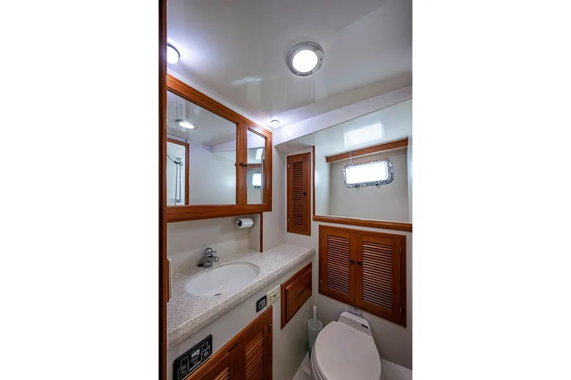Slide: The Image of Luxurious 2008 Kadey-Krogen 44 yacht bathroom with wooden cabinetry and modern fixtures. - 40