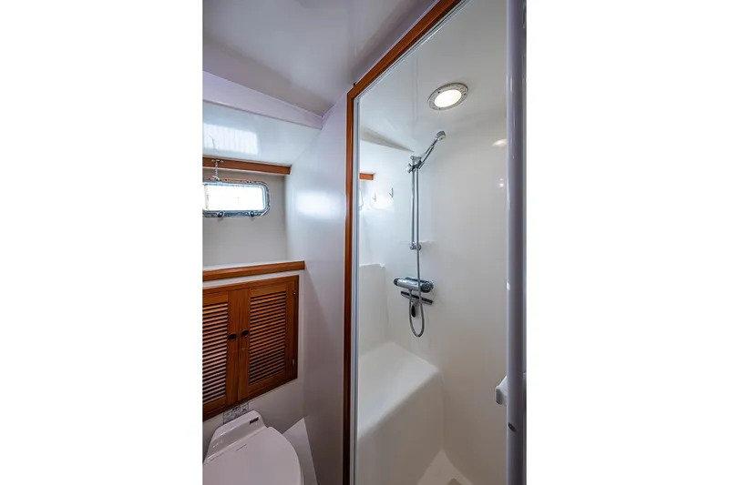Slide: The Image of Bathroom interior of 2008 Kadey-Krogen 44 yacht with shower and wooden accents. - 41