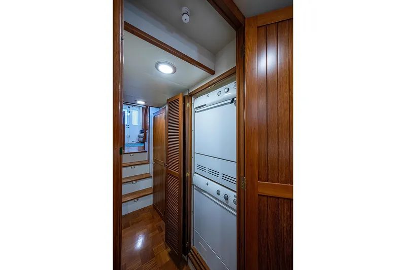 Slide: The Image of 2008 Kadey-Krogen 44 interior with wooden cabinetry and built-in appliances. - 42