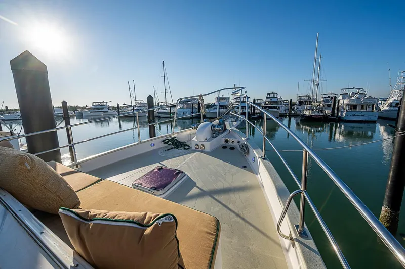 Slide: The Image of 2008 Kadey-Krogen 44 yacht docked in a sunny marina, showcasing deck and railing. - 51