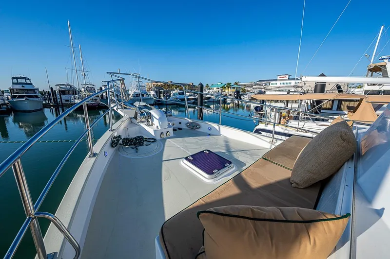 Slide: The Image of Kadey-Krogen 44 yacht, 2008 model, docked in a marina with clear blue skies. - 52