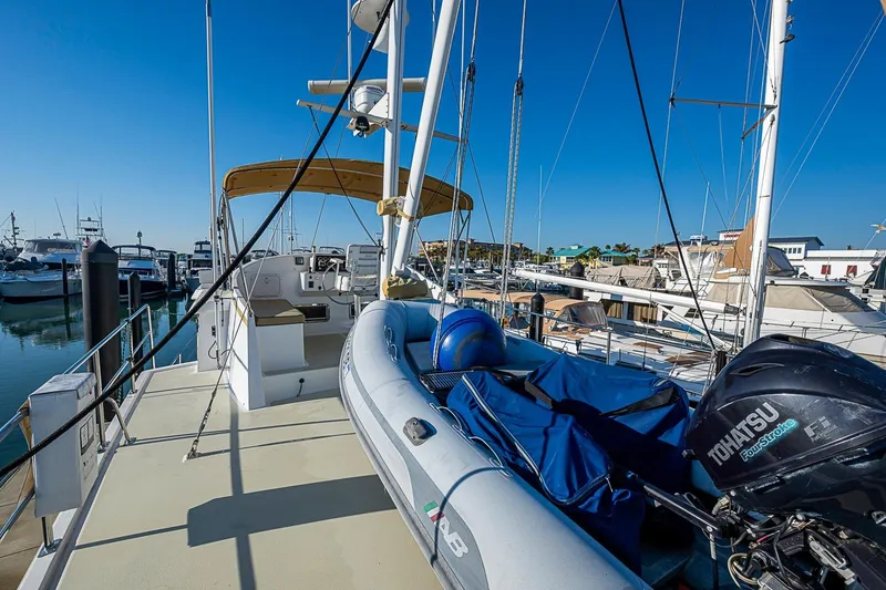 Slide: The Image of 2008 Kadey-Krogen 44 yacht with inflatable boat and Tohatsu motor at marina. - 55