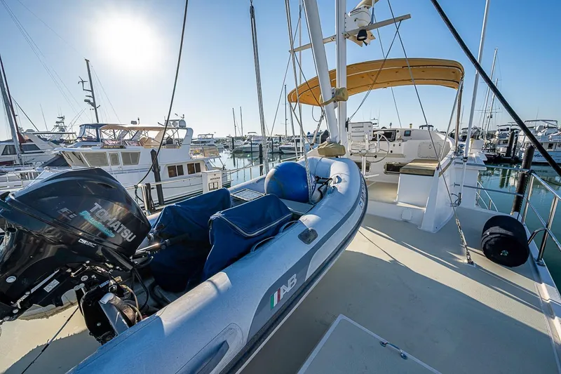 Slide: The Image of 2008 Kadey-Krogen 44 yacht with inflatable boat and Tohatsu motor at marina. - 56