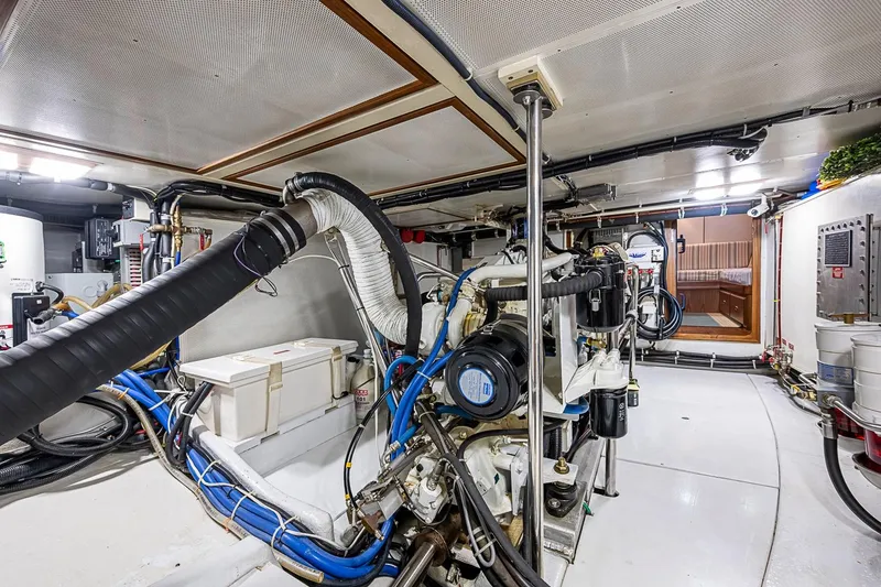Slide: The Image of Engine room of a 2008 Kadey-Krogen 44 yacht, showcasing mechanical systems and equipment. - 65