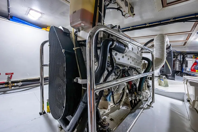Slide: The Image of Engine room of a 2008 Kadey-Krogen 44 yacht, showcasing detailed machinery and components. - 66