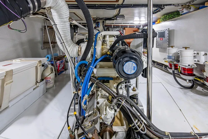 Slide: The Image of Engine room of a 2008 Kadey-Krogen 44 yacht, showcasing detailed mechanical components. - 67