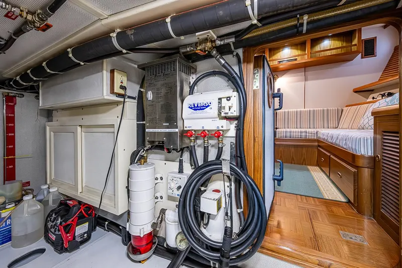 Slide: The Image of Engine room of 2008 Kadey-Krogen 44 yacht, featuring equipment and cozy cabin view. - 68