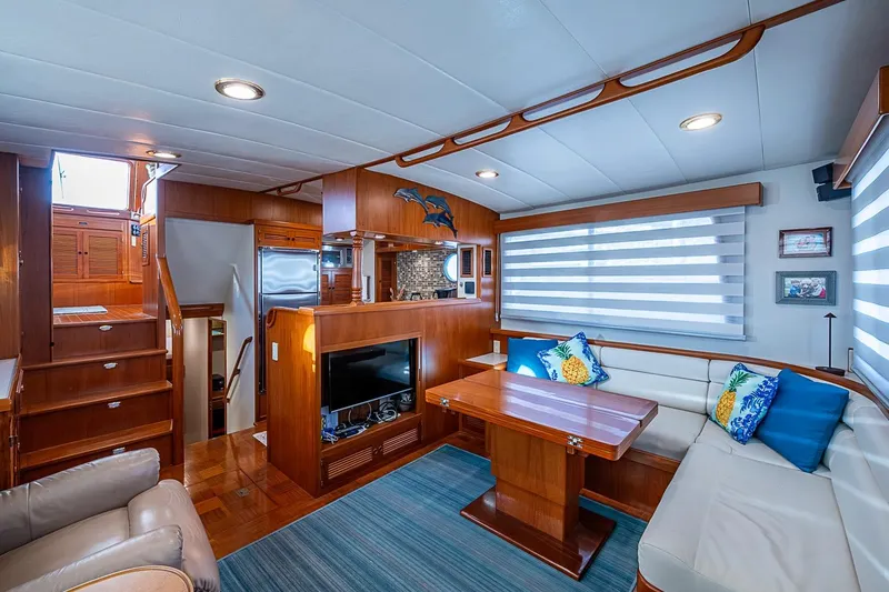 Slide: The Image of Luxurious 2008 Kadey-Krogen 44 yacht interior with elegant wood finishes and cozy seating area. - 7