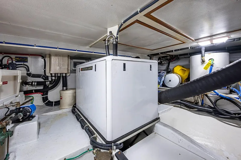 Slide: The Image of Engine room of 2008 Kadey-Krogen 44 yacht with generator and equipment. - 70