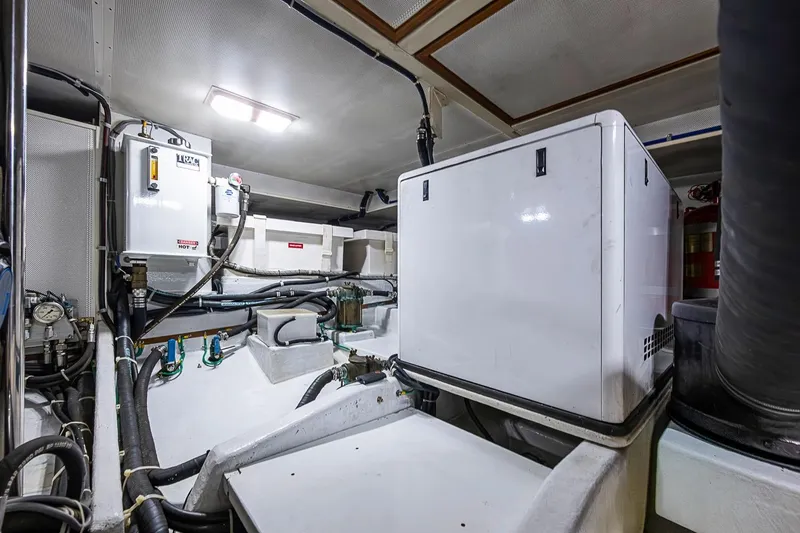 Slide: The Image of Engine room of 2008 Kadey-Krogen 44 yacht, featuring equipment and wiring. - 71