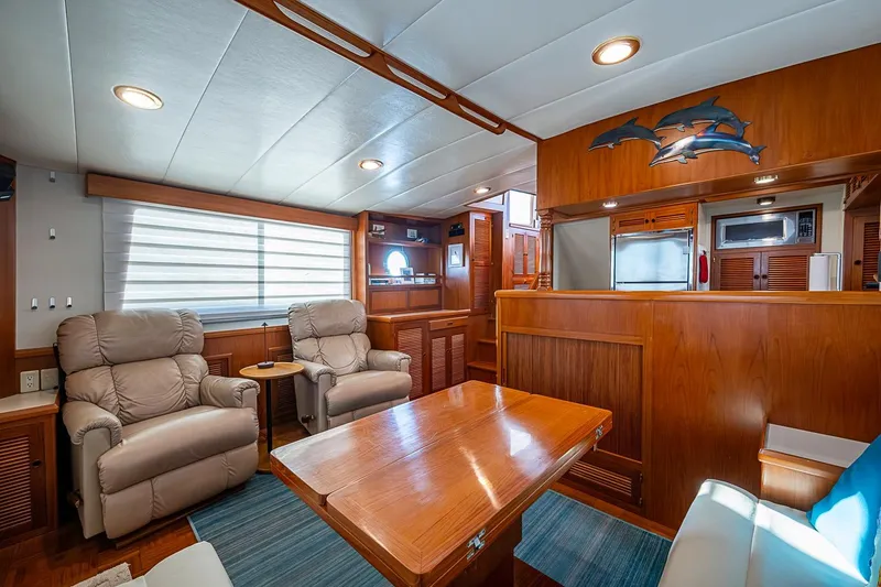 Slide: The Image of Luxurious 2008 Kadey-Krogen 44 yacht interior with plush seating and wooden accents. - 9