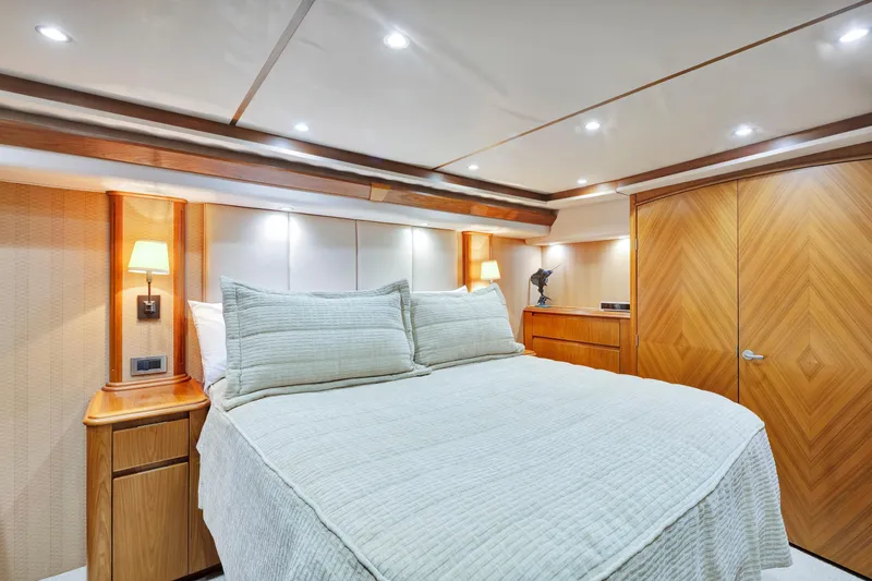 Slide: The Image of Luxurious bedroom interior of 2011 Viking 70 Convertible yacht with elegant wood finishes. - 14
