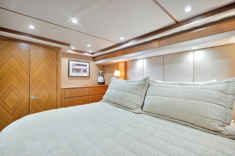 Slide: The Image of Luxurious bedroom interior of 2011 Viking 70 Convertible yacht with elegant wood finishes. - 15